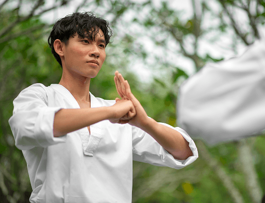 Instructor practicing Kung Fu forms outdoors